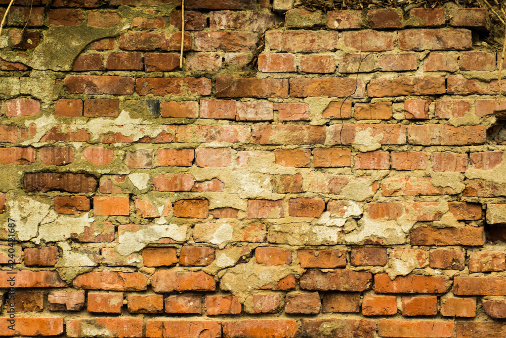 Obraz premium Vintage brick wall. Empty background of brickwork. Sturdy brickwork textured rough surface.