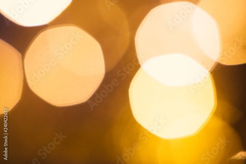 large gold and silver bokeh on a dark background