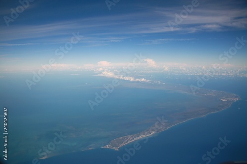 View Out the Window of a Commercial Jet Looking Down at the Atlantic Seaboard Travelling North Up the East Coast of the United States Late in the Afternoon, Mostly Clear with a Few Scattered Clouds