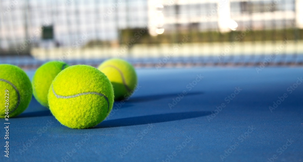 Tennis game. Tennis balls on the tennis court. Sport, recreation concept 