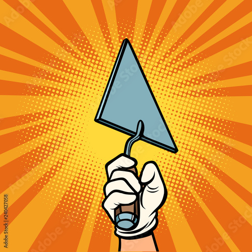hand with construction trowel