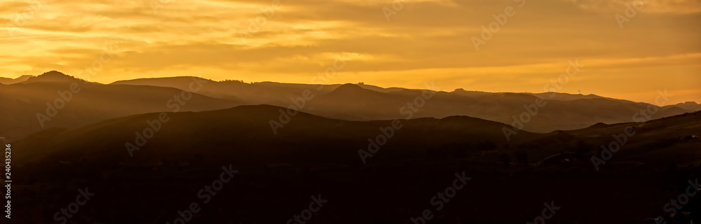 Panorama of Layered Mountains at Sunset
