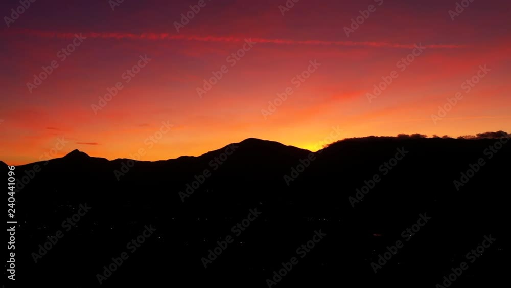 Aerial view of a spectacular sunset over some beautiful mountains in Italy. Aerial view of a spectacular sunset over some beautiful mountains in Italy.