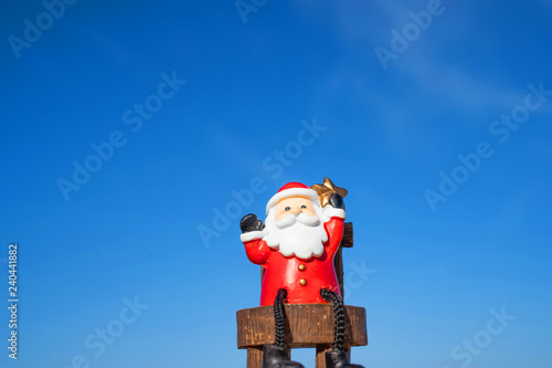 Christmas Santa hold star.on the beach are texture Nature background creative bokeo tropical layout made at phuket Thailand photo