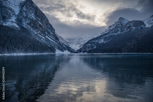 Lake Louise Banff Canada during the winter season. Blue hour after sunset on a cold winter night. Still glacial lakes in the Canadian Rockies. First snow fall at Lake Louise. © kaiyhun