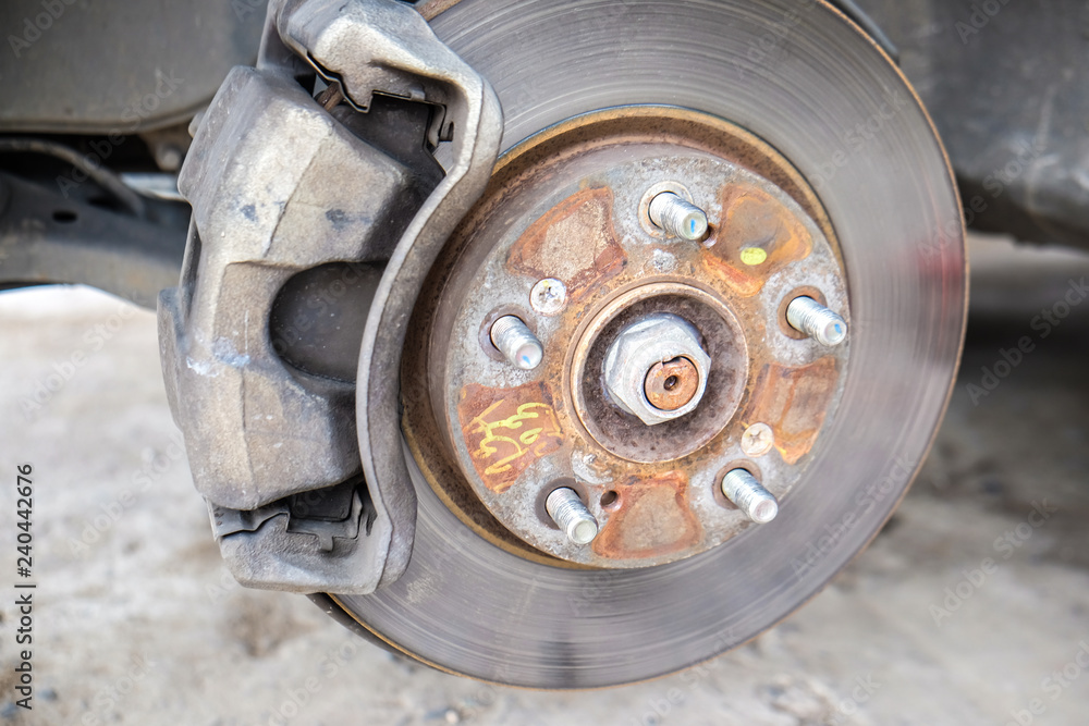 Fototapeta premium Car disk brake repair in garage