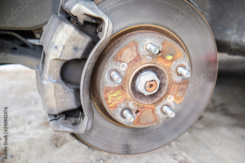 Car disk brake repair in garage © themorningglory