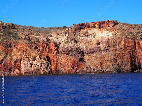 red rock with blue sky and sea