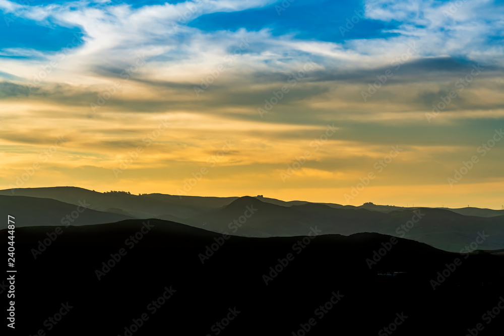 Obraz premium Layers of Mountains at Sunset