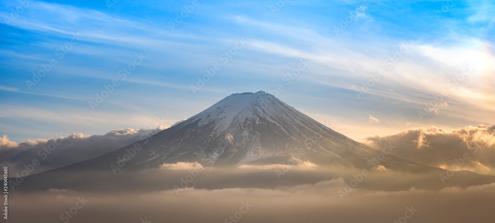 Mountain Fuji in sea of mist or fog at sunrise with cloudy sky, Fujikawaguchiko, Yamanashi, Japan.