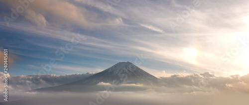 Mountain Fuji in sea of mist or fog at sunrise with cloudy sky, Fujikawaguchiko, Yamanashi, Japan.