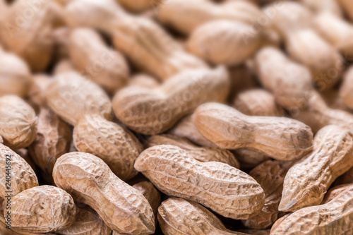 Peanuts in a shell blurred background, copy space, close-up, top view