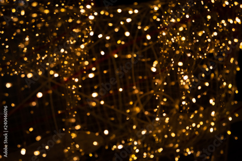 Gold yellow light abstract bokeh on black background