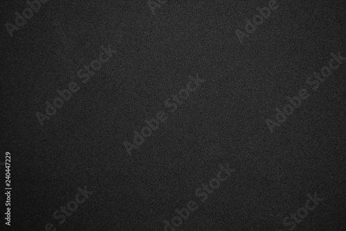 Black glitter background with tiny rough grain textured, Sandpaper texture abstract background. photo
