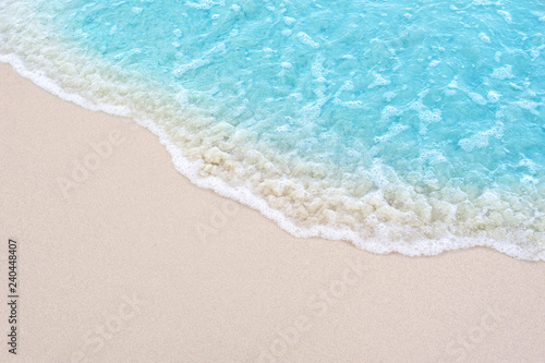 beautiful sandy beach and soft blue ocean wave © OHishi_Foto
