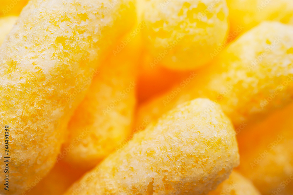 Closeup Image of Yellow Corn Puffs. Crunchy Flavored Puffed Snacks. Party, Movie, TV, Game Snacks. Closeup Image of Yellow Corn Puffs. Crunchy Flavored Puffed Snacks. Party, Movie, TV, Game Snacks.