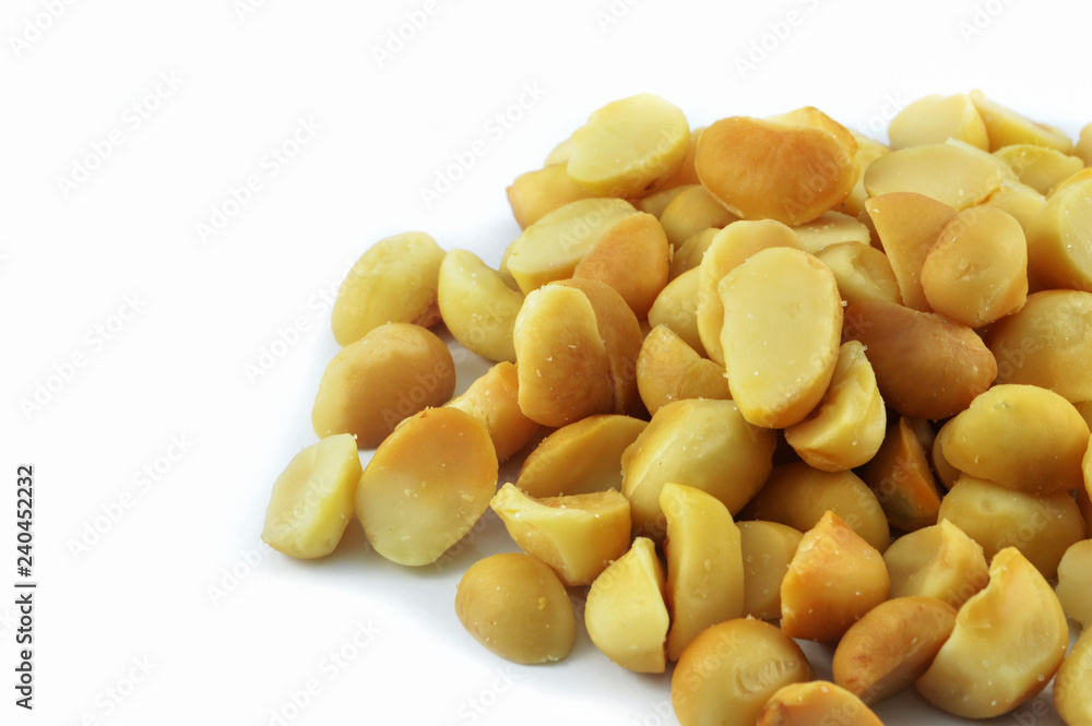 Macadamia nuts isolated on white background / Organic salted macadamia nuts roasted with salt Macadamia nuts isolated on white background / Organic salted macadamia nuts roasted with salt