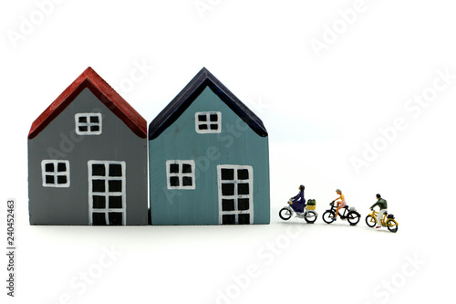 Miniature people : Friend Group ride bicycle with family of house,happy family day concept.