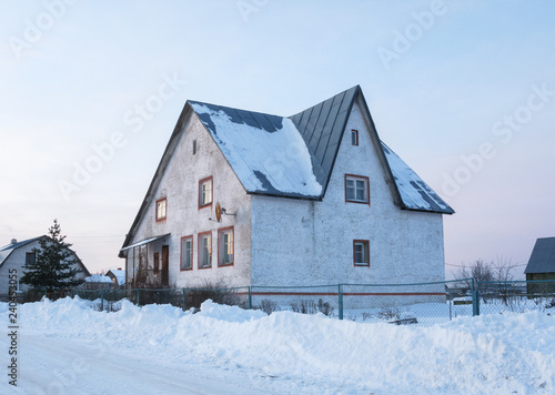 Concrete cottage in winter time