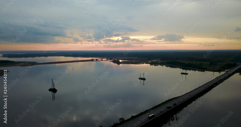 Beautiful sunset over the river Volga, a reflection of the sunset