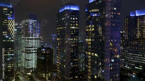 JAKARTA, Indonesia - December 17, 2018: Beautiful aerial view of skyscrapers with night lights in modern business center at Jakarta city. Shot in 4k resolution photo
