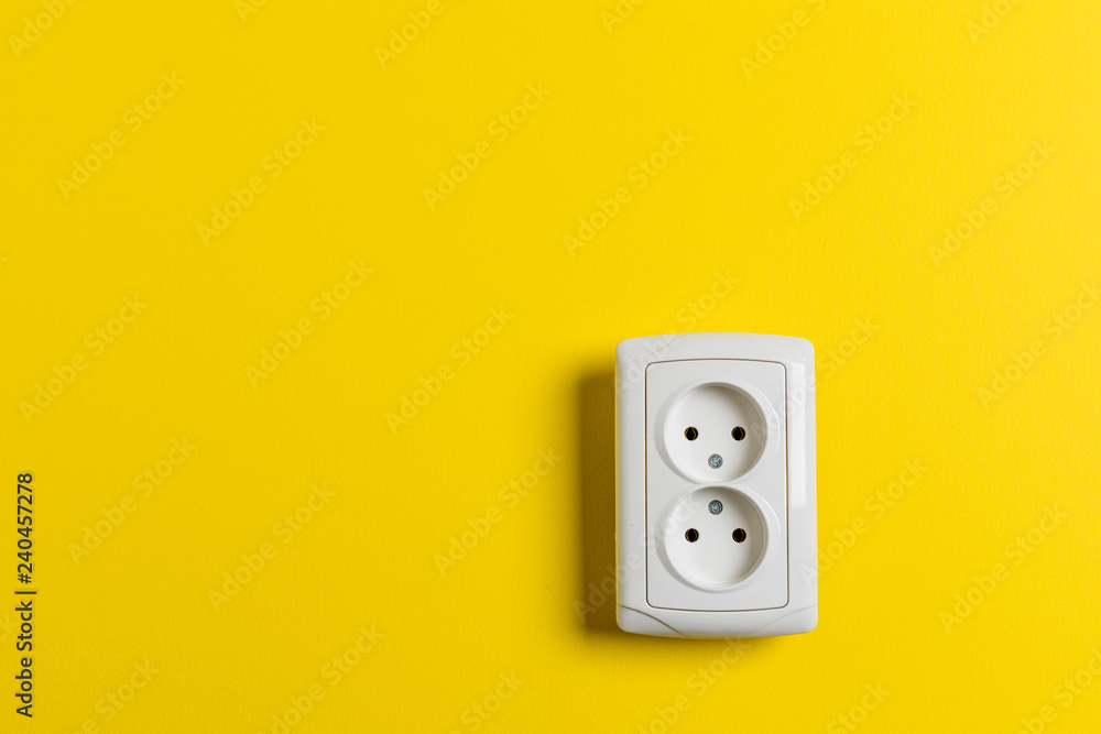 socket on yellow wall socket on yellow wall