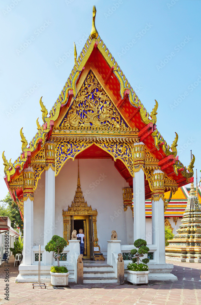 Fototapeta premium Bangkok, Thailand Wat Pho Temple Of The Reclining Buddha. Pagoda. There are many beautiful pagodas on the territory. Richly decorated roofs are visible everywhere. 