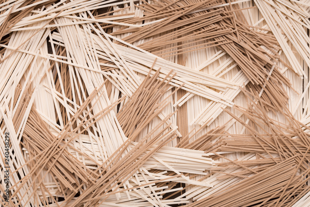 Mix of raw noodles background, copy space Mix of raw noodles background, copy space