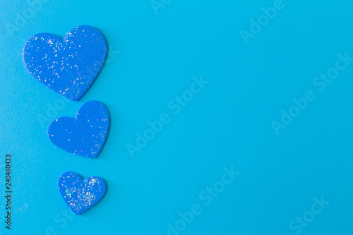  heart on blue background close up image.