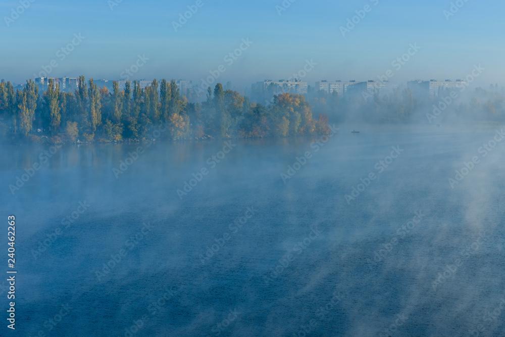 Fototapeta premium City Kremenchug in fog on autumn day