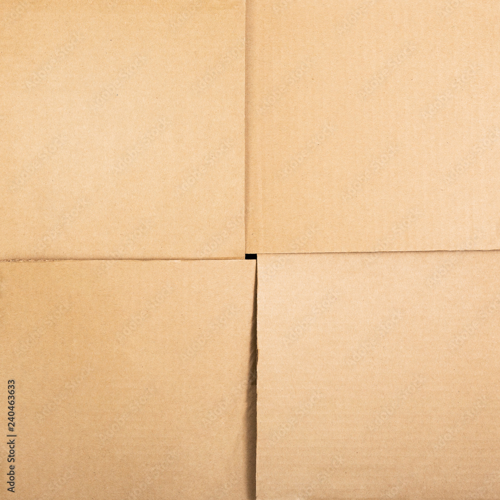 Fototapeta premium Square cardboard box background. Top view