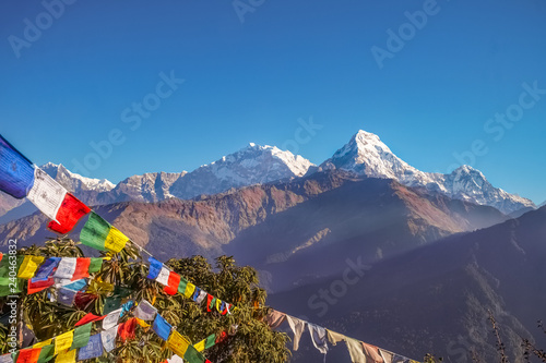 Buddhist Prayer Flags Hanging along Hiking Paths in Nepal. Trekking in the Himalayas