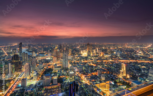 Cityscape of light traffic with skyscraper and Chao Phraya river at Bangkok metropolis