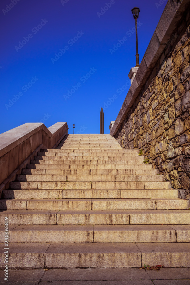 Stone stairways at the center of the city during a sunny day.
