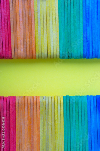 Colorful wooden or ice cream stick with selective focus and crop fragment