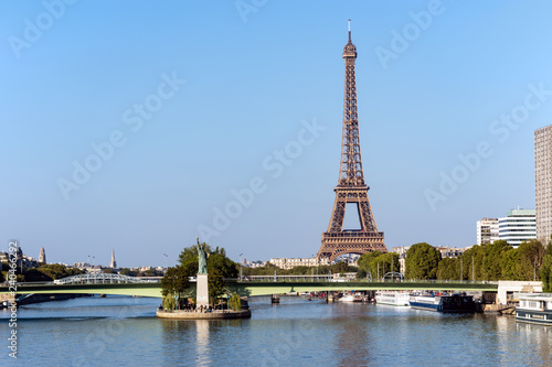 Replica of the Statue of Liberty on the Ile aux Cygnes with Eiffel tower in background - Paris, France © UlyssePixel