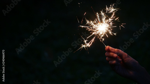Happy new year with hand hold burning bengal light