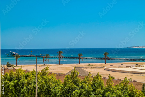 The view from the hotel window to the red sea  the beach and the marina under the blue sky