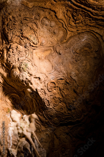 Circular shapes on the ceiling in the cave.