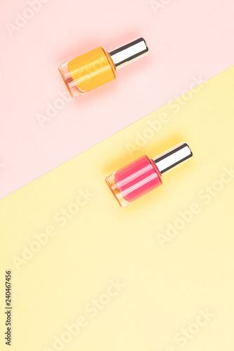 Nail polishes on colorful background
