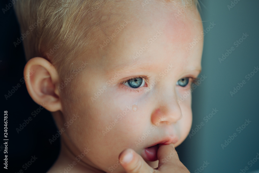 These weepy eyes. Little boy child with sad face. He is a cry baby. Little baby crying. Baby with tear rolling down his cheek