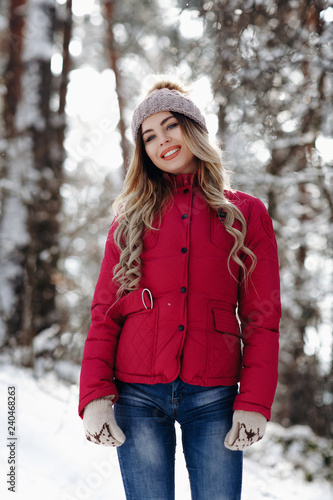 young beautiful smiling white tooth girl with amazing hair portrait wearing purple down jacket in winter snowy forest. Winter holiday concept - Image