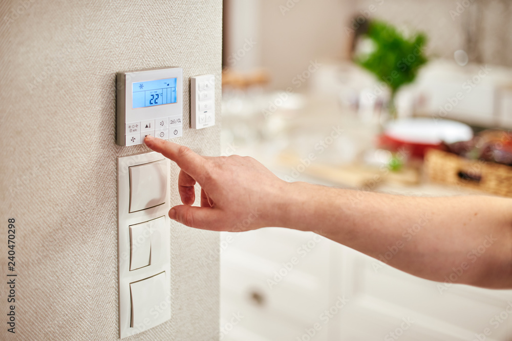 Digital Thermostat and male hand Digital Thermostat and male hand