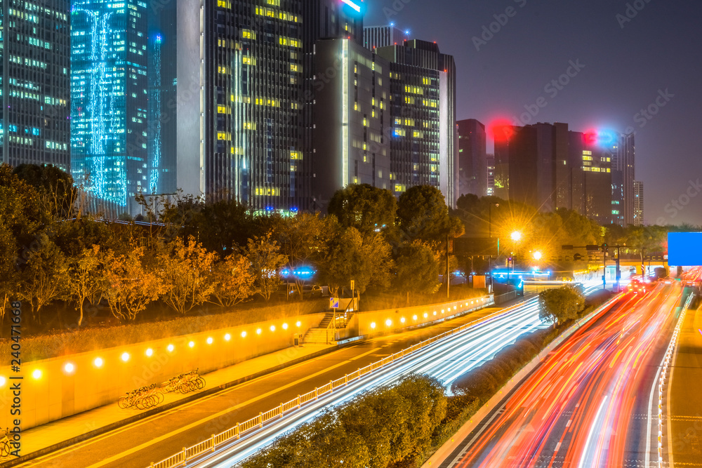 traffic light through city at night in china