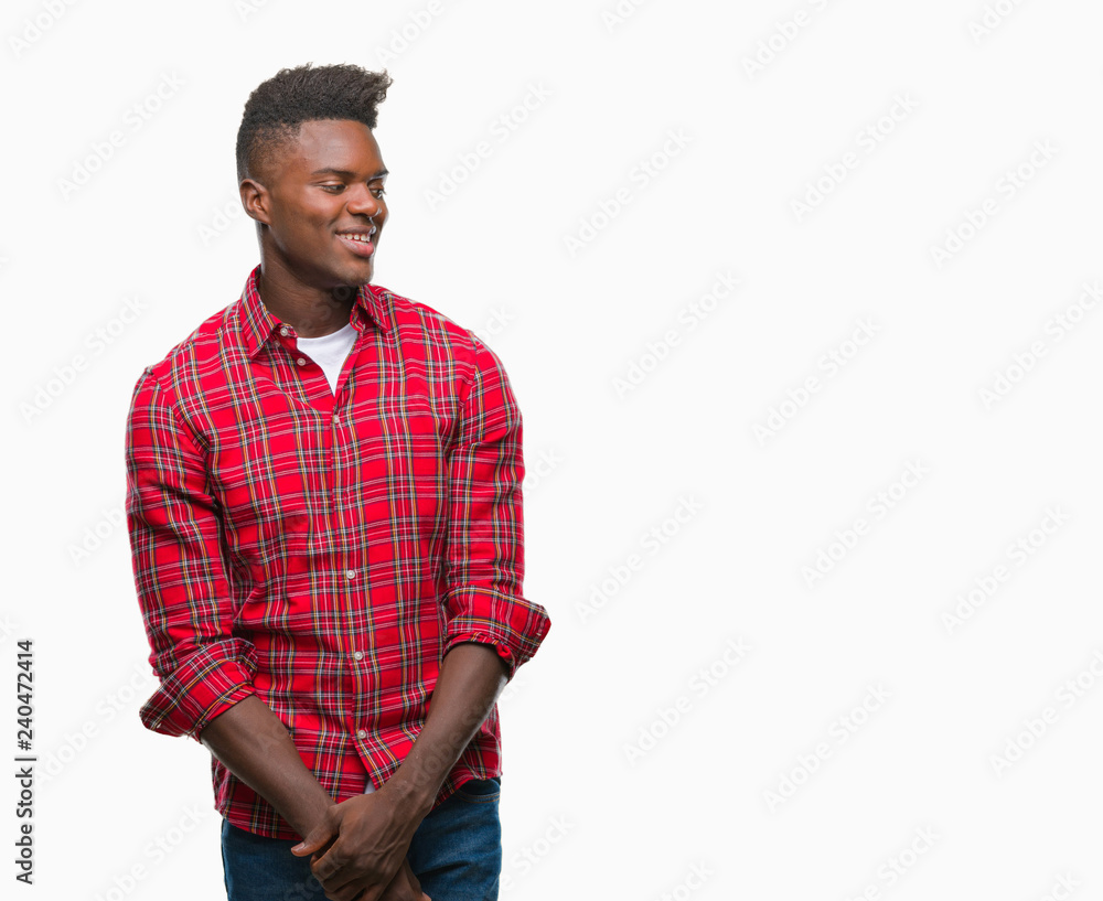 Young african american man over isolated background looking away to side with smile on face, natural expression. Laughing confident. Young african american man over isolated background looking away to side with smile on face, natural expression. Laughing confident.
