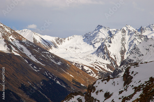 mountain slopes in autumn with snow-covered peaks in the mountain gorge of teberdin reserve Karachay-Cherkessia photo