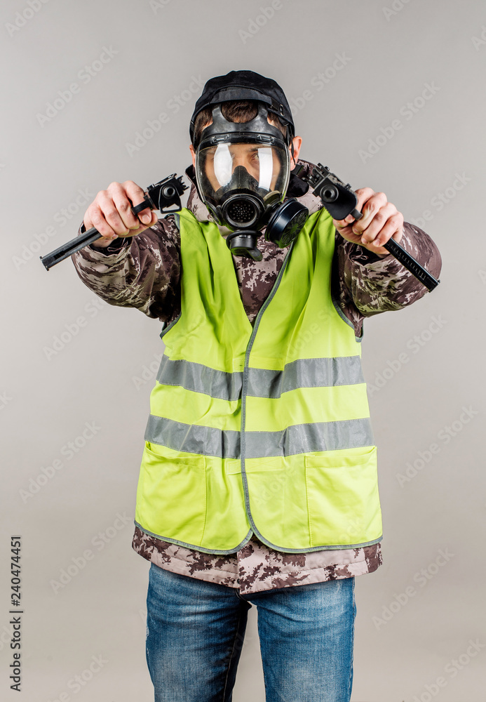 Rebel with gas mask on gray background. Law concept. Rebel with gas mask on gray background. Law concept.