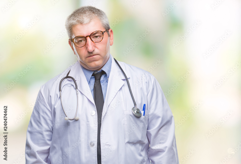 Handsome senior doctor man over isolated background depressed and worry for distress, crying angry and afraid. Sad expression. Handsome senior doctor man over isolated background depressed and worry for distress, crying angry and afraid. Sad expression.