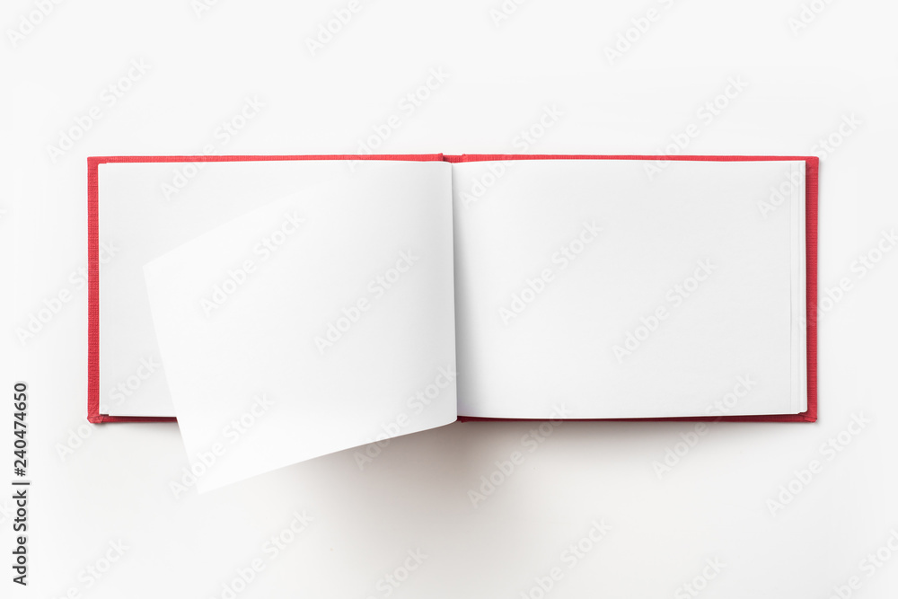 Top view of red notebook with open page Top view of red notebook with open page