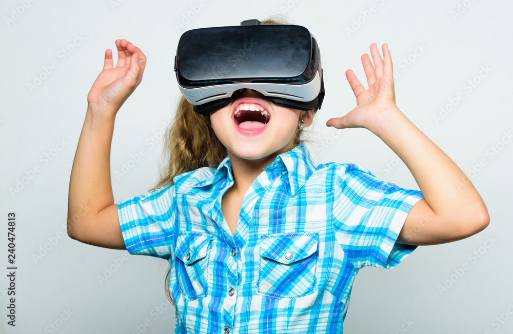 Girl cute child with head mounted display on white background. Virtual reality concept. Small kid use modern technology virtual reality. Virtual education for school pupil. Get virtual experience Girl cute child with head mounted display on white background. Virtual reality concept. Small kid use modern technology virtual reality. Virtual education for school pupil. Get virtual experience